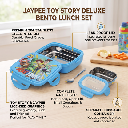 JAYPEE TOY STORY DELUXE BENTO LUNCH SET on a light wood tabletop with a window and kitchen props in the background. The set includes a blue plastic bento box with a colorful Toy Story-themed lid, a separate stainless steel container, a small spoon, and a separate clear lid.